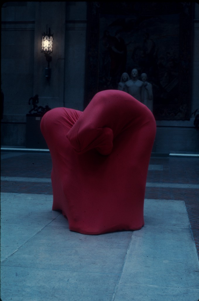 Dancers under red fabric in gallery atrium - slide