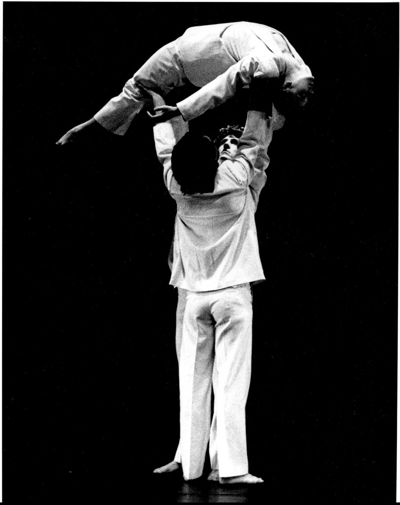 2 men lift dancers in arch (side view)72