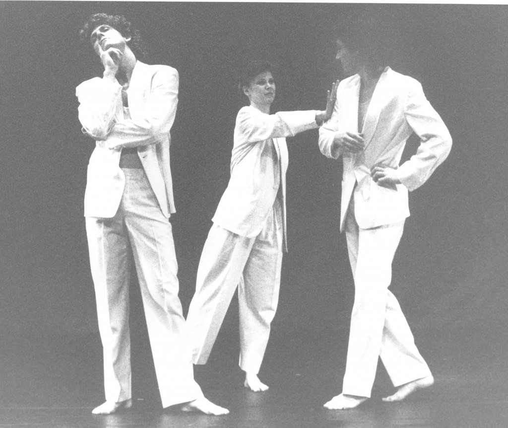 3 dancers stand around in suits72